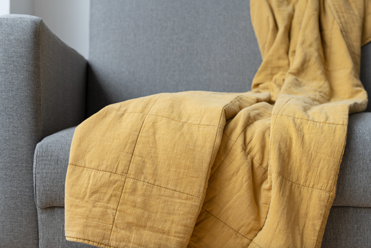 The Art of Layering with Sofa Covers: Using Throws and Cushions Alongside Slip Covers for a Luxurious Feel